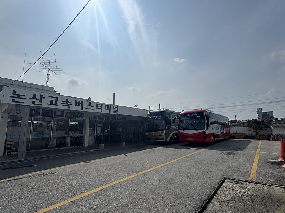 Two Kumho express coaches beside the Nonsan Express Bus Terminal building.