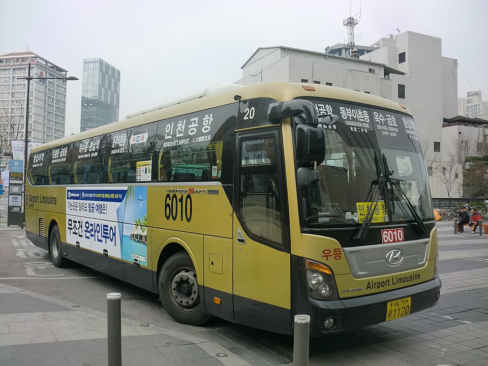 A yellow and grey Airport Limousine bus with an Incheon Airport sign and route number 6010